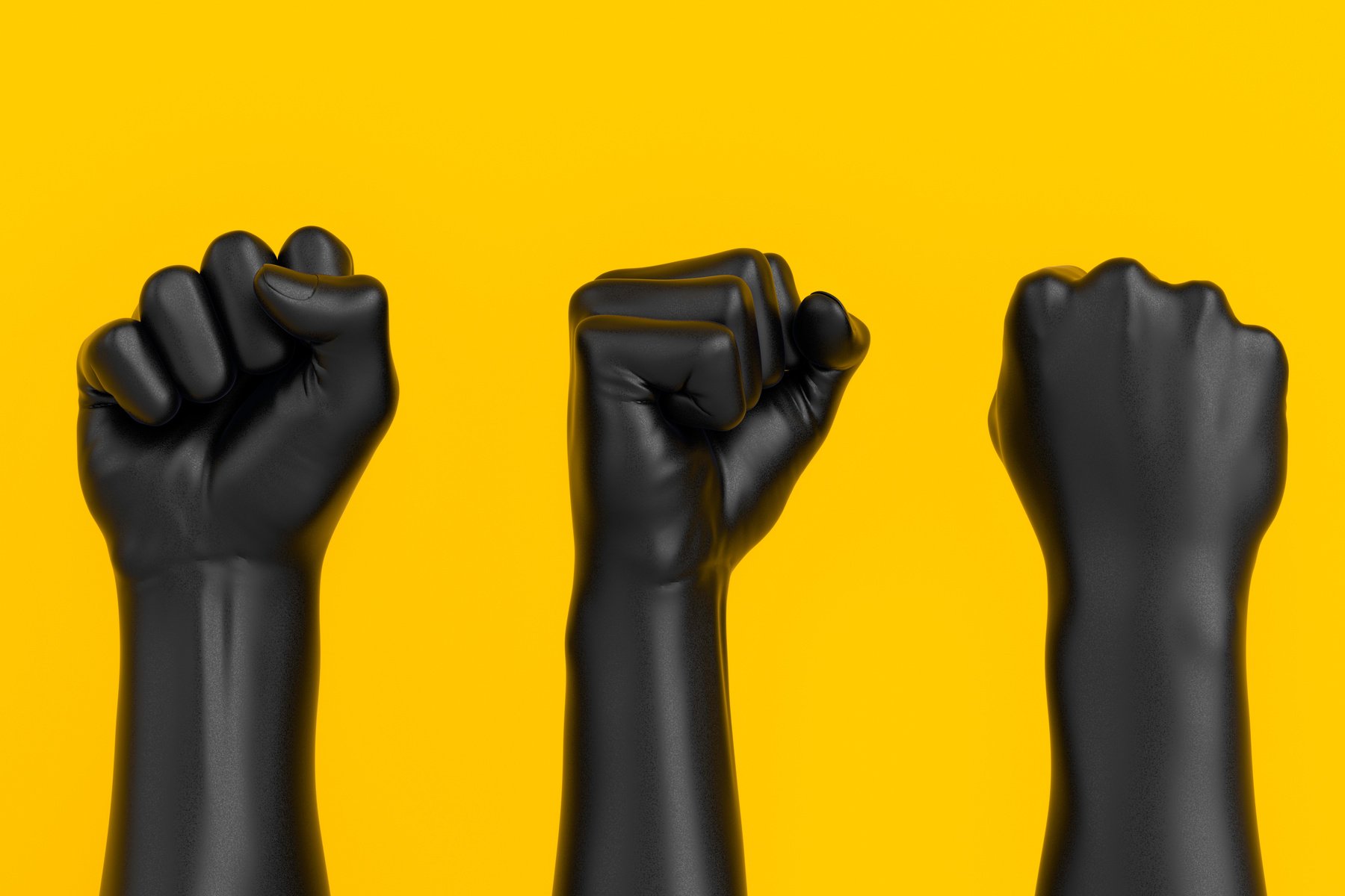 three fists on a yellow background